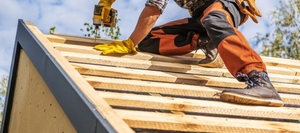 Contractor installing a roof